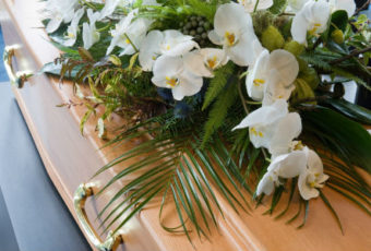 A bouquet of flowers on top of a wooden table.